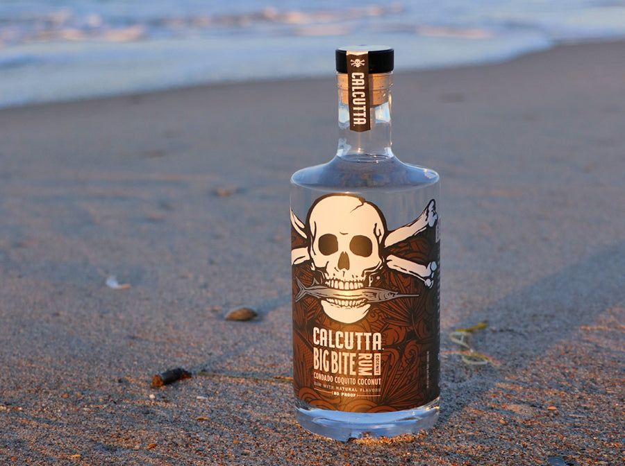 Calcutta Big Bite Rum Coconut flavor on beach