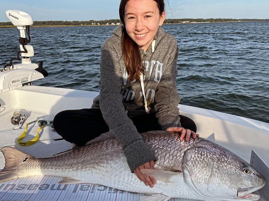 Junior Angler with IGFA World Record Red Fish Caught with Star Rods