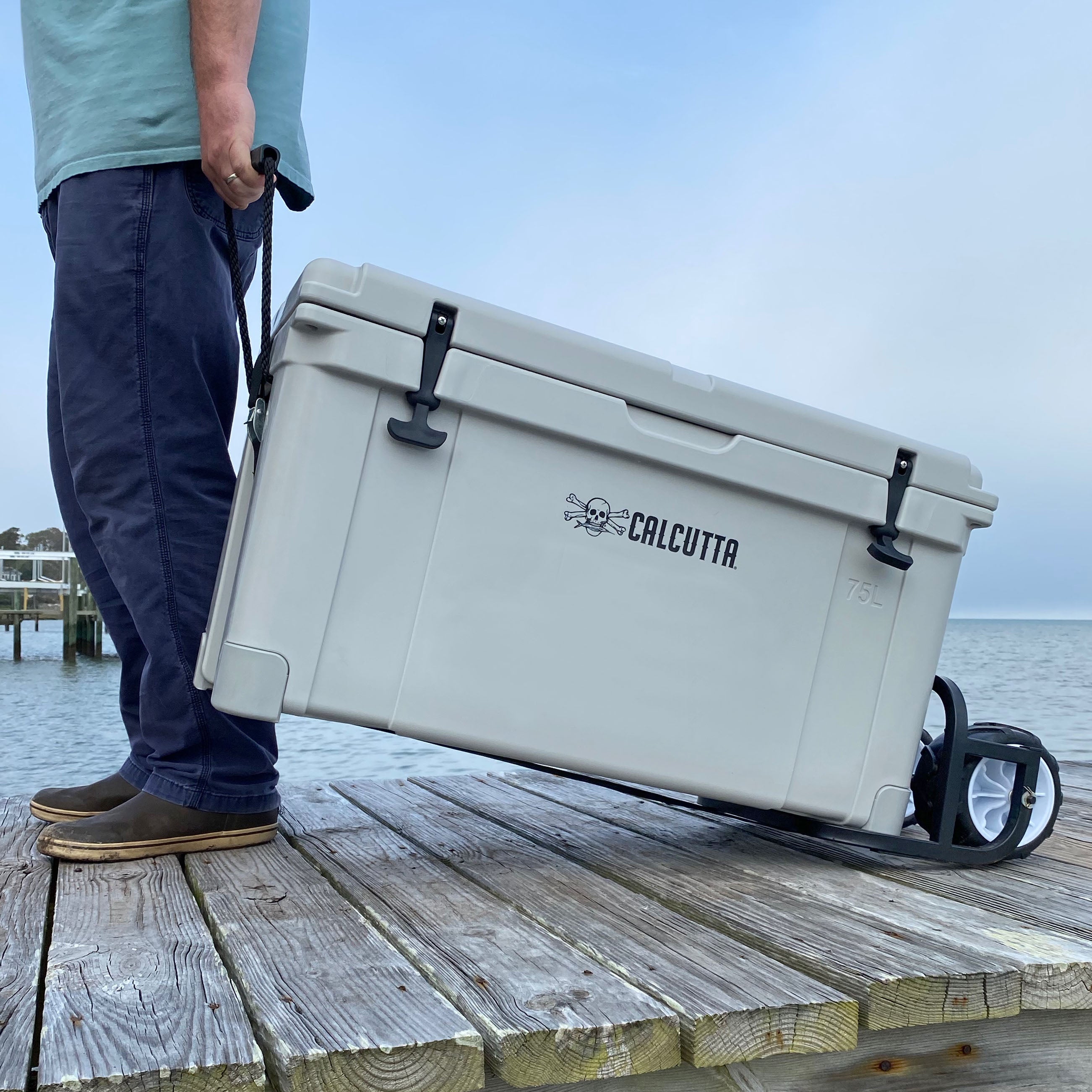 Calcutta cooler cart wheel kit on dock with Calcutta cooler