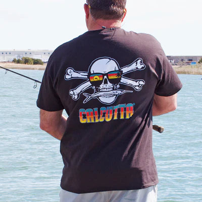 Fisherman wearing Calcutta t-shirt with skull and sunglasses