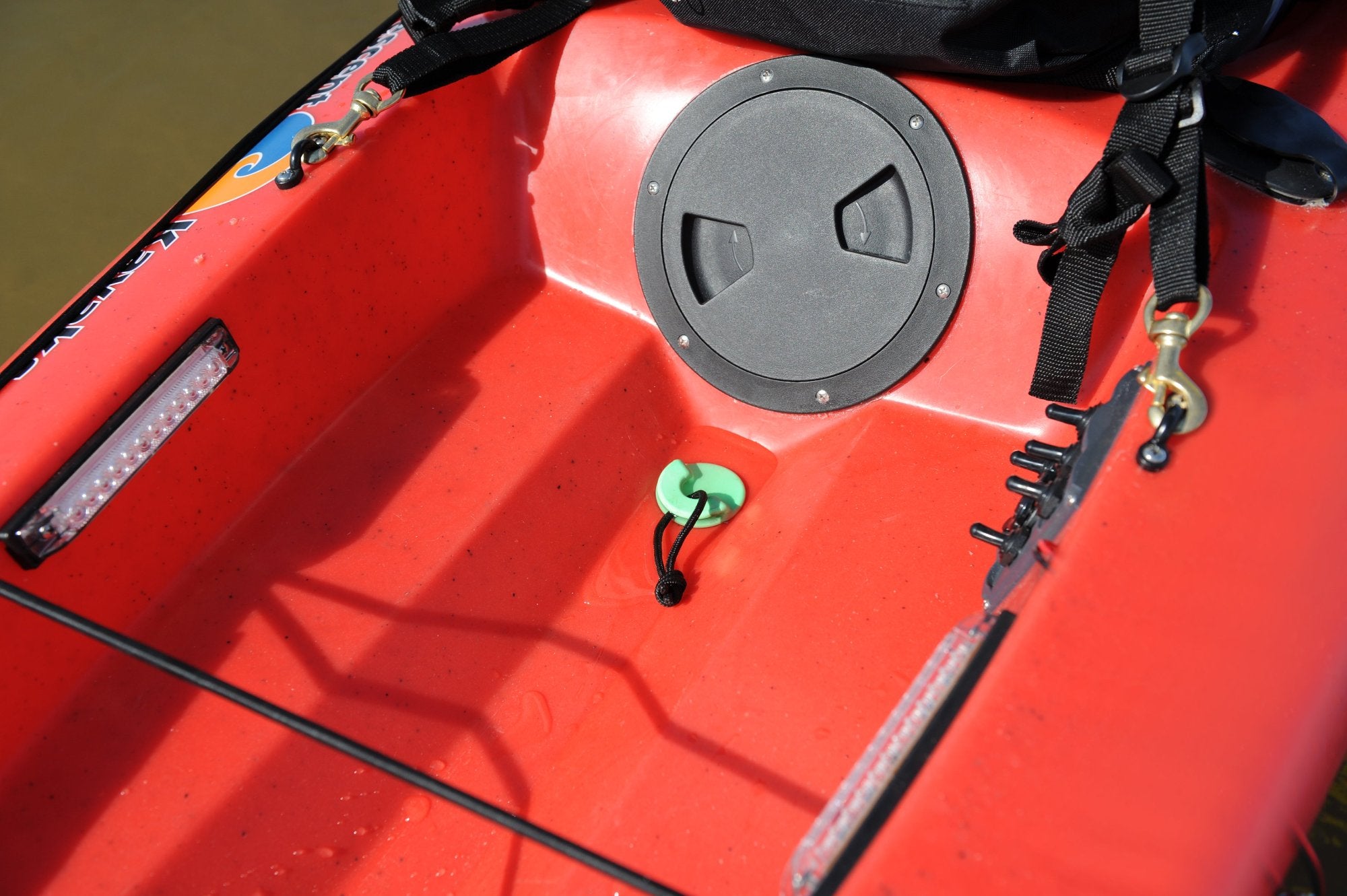 Kayak scupper stopper in use