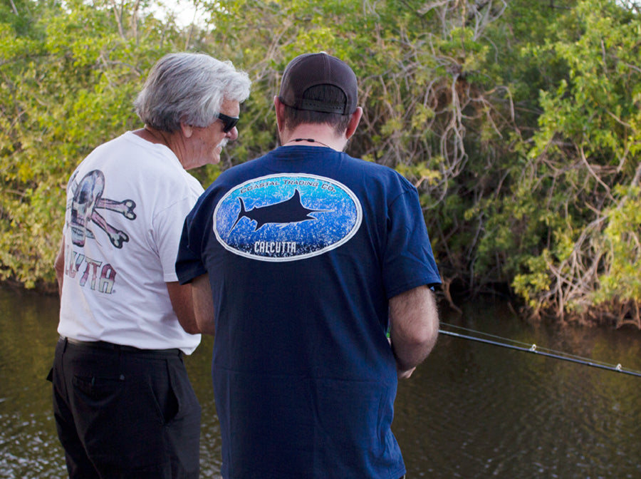 Father and son fishing on Father’s Day in Calcutta Outdoors shirts
