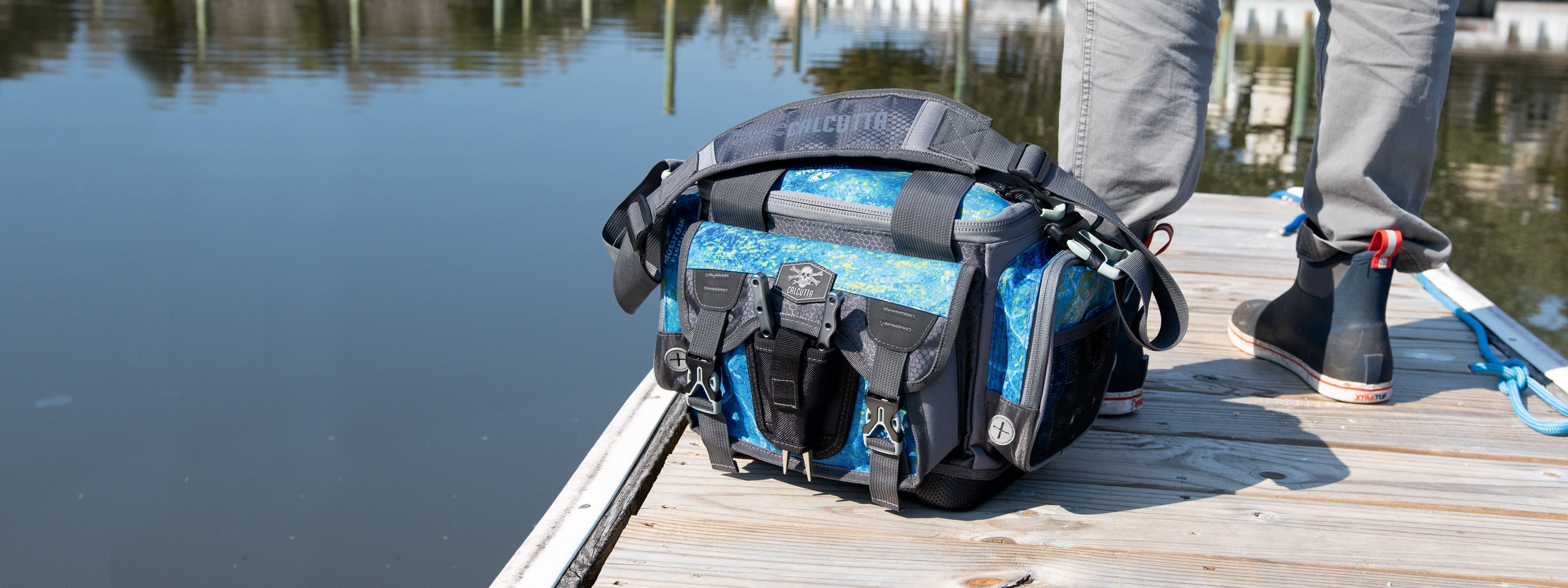 Fisherman with Calcutta tackle backpack