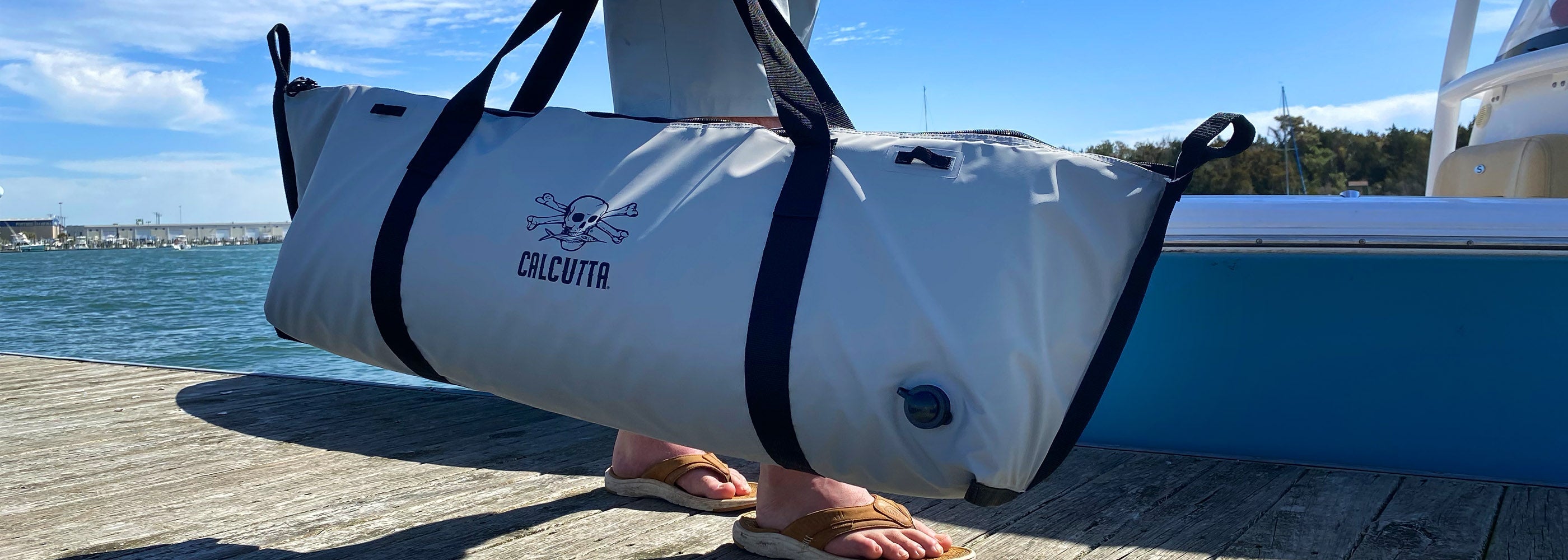 Calcutta fish kill bag with boat and water in background