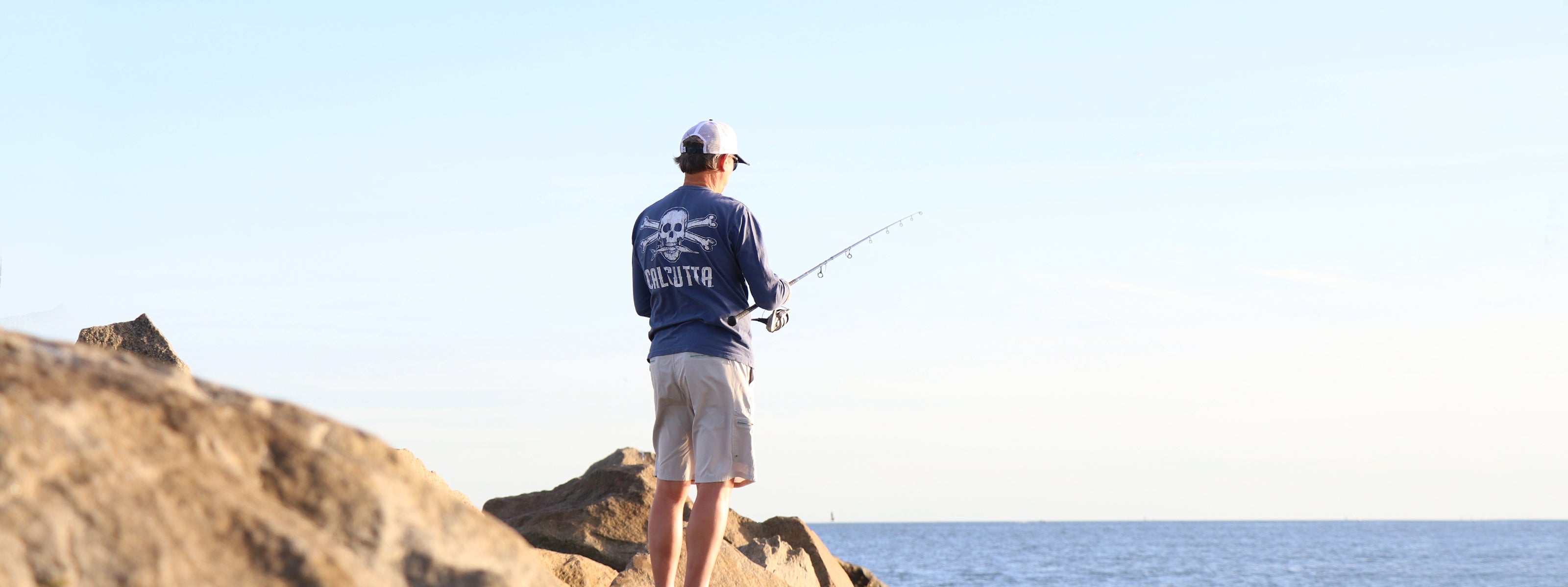 Fisherman on jetty in Calcutta shirt