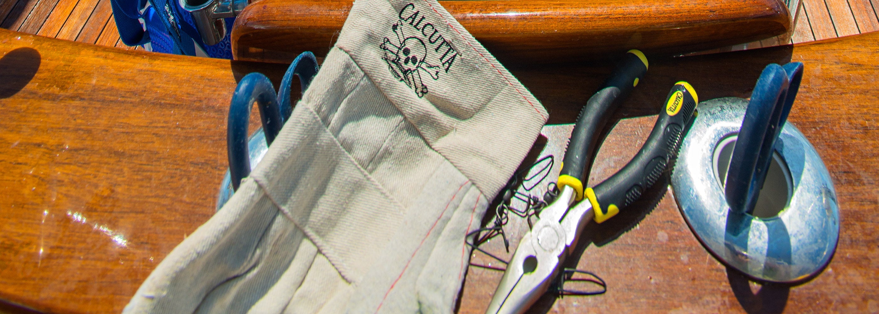 Calcutta fishing pliers on back of fighting chair