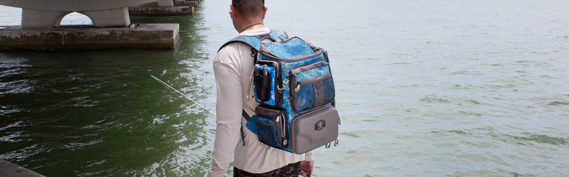 Fisherman with Calcutta tackle backpack