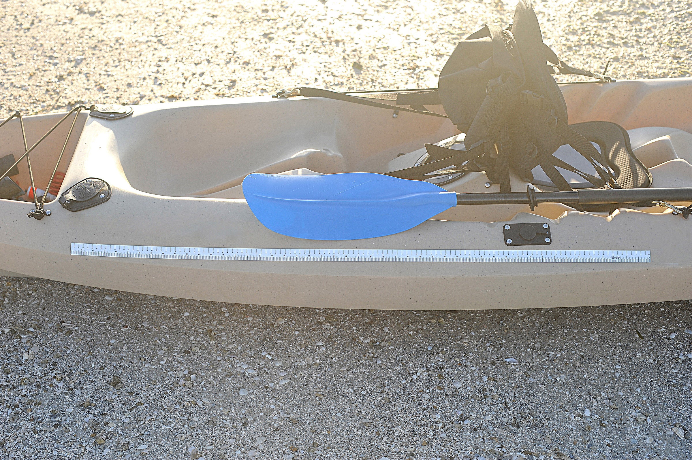 Fish measuring tape on kayak